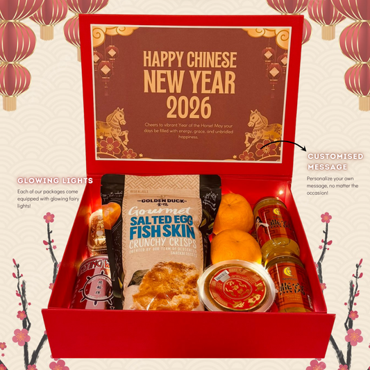Chinese New Year care package with festive treats and traditional gifts Singapore. Red gift box with Chinese New Year 2026 theme, containing food items and decorative elements.