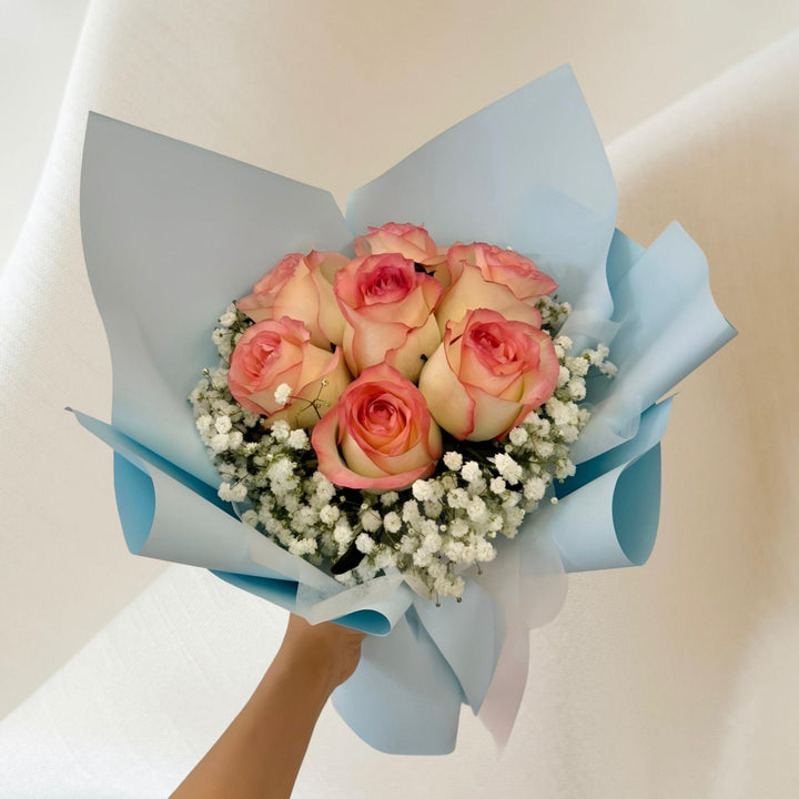 Blush Serenity pink rose bouquet wrapped in pastel blue in Singapore